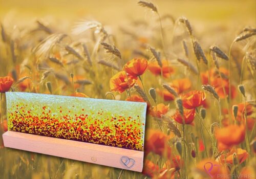 Fleurs des Champs lamp in fused glass with orange and wheat gradations, set on a hardwood base, illuminating a room with warmth and poetic ambience.