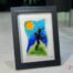 Work in fused glass representing two lovers embracing in a landscape inspired by nature. Unique creation - Amoureux No. 4- signed Stéphanie Béland - Percé-Verre.
