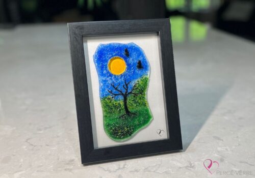Work in fused glass representing a delicately carved tree, integrated into a colored or abstract background. Arbre No. 3 - Created by Stéphanie Béland - Percé-Verre.