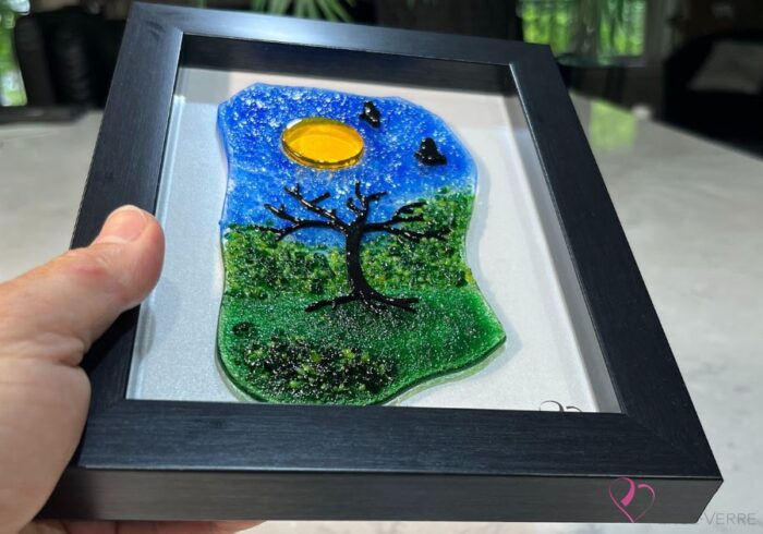 Work in fused glass representing a delicately carved tree, integrated into a colored or abstract background. Arbre No. 3 - Created by Stéphanie Béland - Percé-Verre.