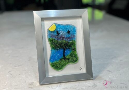 Work in fused glass representing a delicately carved tree, integrated into a colored or abstract background. Arbre No. 4 - Created by Stéphanie Béland - Percé-Verre.