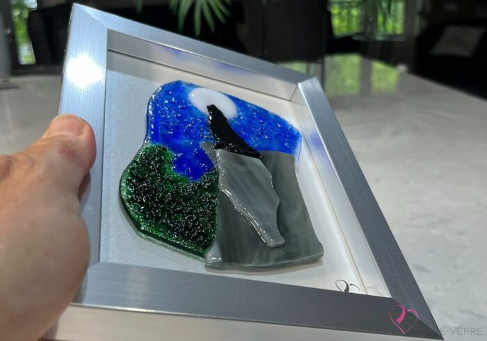 Work in fused glass depicting a wolf howling under the moon, framed 5 x 7. Nature sauvage collection, Loup No. 2, signed Percé-Verre.