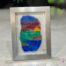 Éclats marins No. 1 - Work in fused glass depicting a vibrantly colored landscape of sea, mountains and sunset.