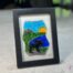 Work in fused glass depicting a moose in a natural Quebec landscape, unique creation Orignal No. 4, signed Stéphanie Béland - Percé-Verre.