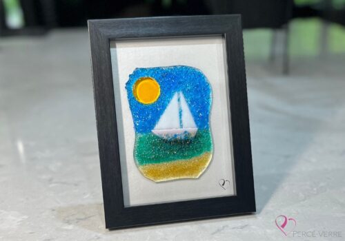 Fused glass work depicting a sailboat on the sea, framed 5 x 7. Cap sur les rêves collection, signed Percé-Verre.