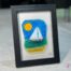 Fused glass work depicting a sailboat on the sea, framed 5 x 7. Cap sur les rêves collection, signed Percé-Verre.