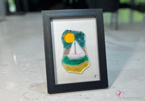 Voilier No. 2 Fused glass work depicting a sailboat on the sea, framed 5 x 7. Cap sur les rêves collection, signed Percé-Verre.