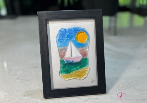 Voilier No. 3 Fused glass work depicting a sailboat on the sea, framed 5 x 7. Cap sur les rêves collection, signed Percé-Verre.