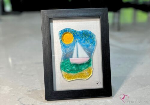 Voilier No. 4 Fused glass work depicting a sailboat on the sea, framed 5 x 7. Cap sur les rêves collection, signed Percé-Verre.