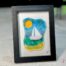 Voilier No. 4 Fused glass work depicting a sailboat on the sea, framed 5 x 7. Cap sur les rêves collection, signed Percé-Verre.