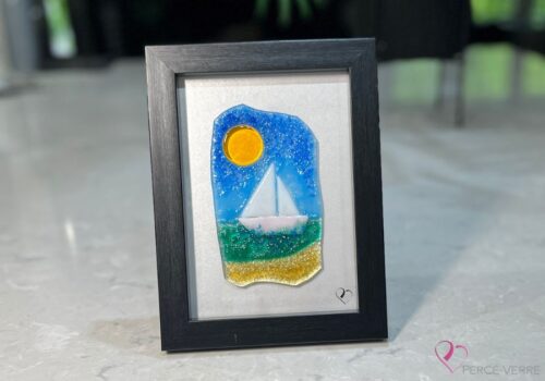 Voilier No. 5 Fused glass work depicting a sailboat on the sea, framed 5 x 7. Cap sur les rêves collection, signed Percé-Verre.