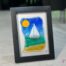 Voilier No. 6 Fused glass work depicting a sailboat on the sea, framed 5 x 7. Cap sur les rêves collection, signed Percé-Verre.