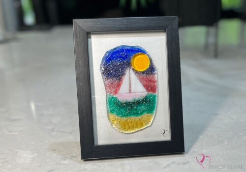 Voilier No. 8 Fused glass work depicting a sailboat on the sea, framed 5 x 7. Cap sur les rêves collection, signed Percé-Verre.