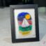 Voilier No. 8 Fused glass work depicting a sailboat on the sea, framed 5 x 7. Cap sur les rêves collection, signed Percé-Verre.